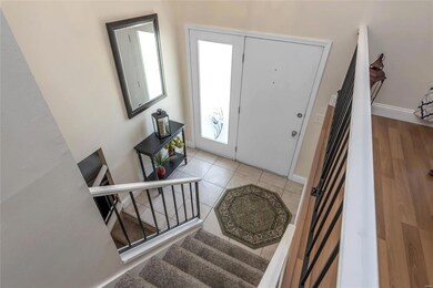 Entry foyer with ceramic tile.