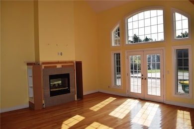 Great Room with Two sided fireplace and French doo