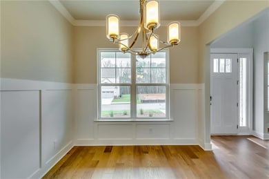 Unfurnished dining area with a decorative wall, pl