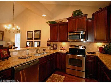 Cafeteria/Kitchen. Picture from prior unit built, finished home may vary from picture.