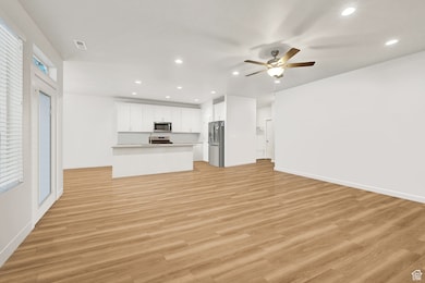 Empty living room / kitchen area