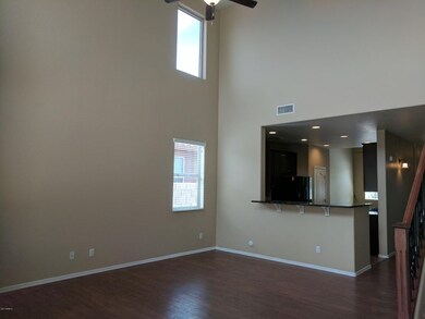 Kitchen looks into family room