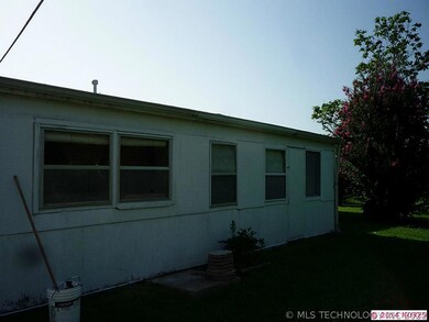 Back of home showing enclosed patio