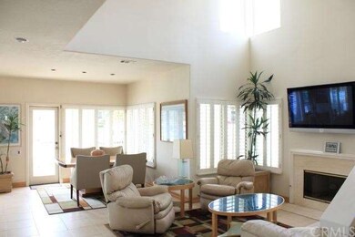 Light and bright lib=ving area with vaulted ceilin