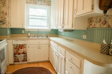 This remodeled kitchen is a charmer, with every inch used brilliantly! There is loads of cabinet space!
