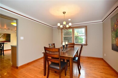 Formal dining room graced with an elegant chandeli
