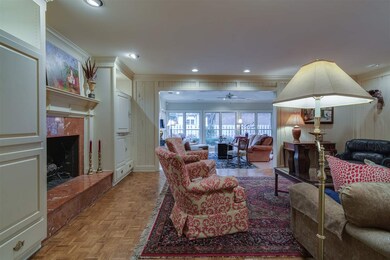 Living room opens to den and sunroom