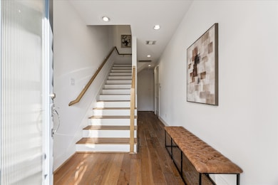 The entry leads upstairs or down the hall to a first-floor bedroom with en-suite bath.  Garage access is off the main entry hallway.  A MASSIVE closet under the stairs is one of just many spacious storage options throughout the home.