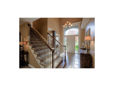 Gorgeous entry with updated light fixture, iron sp