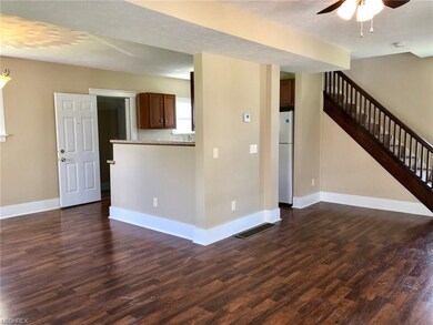 Tasteful paint colors and laminate flooring throug