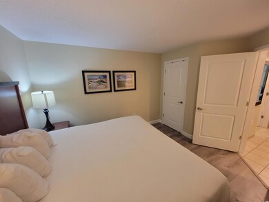 Bedroom with baseboards and wood finished floors