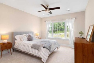 Owner's suite is spacious and leads to private ful