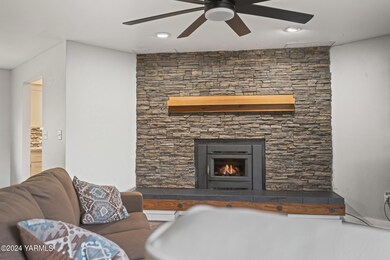 Rock Lined Wood Stove With Gorgeous Mant