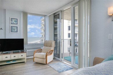 Bedroom with a textured ceiling, access to outside