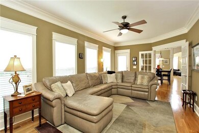 Den off of Kitchen with double doors  