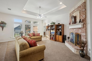 Open living room with cozy brick fireplace