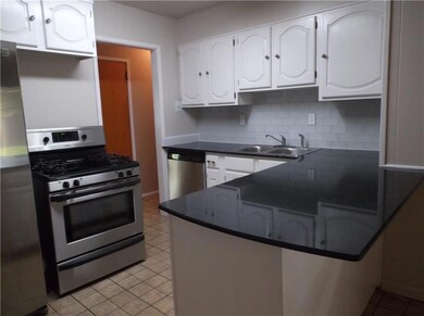 Kitchen showing stainless steel dishwasher and dou