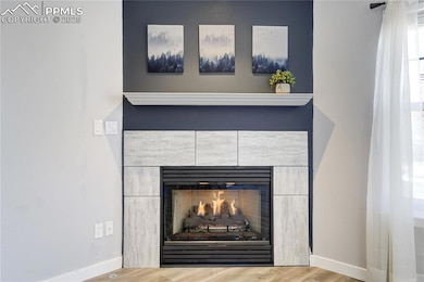 Detailed view of wood finished floors, a tiled fir