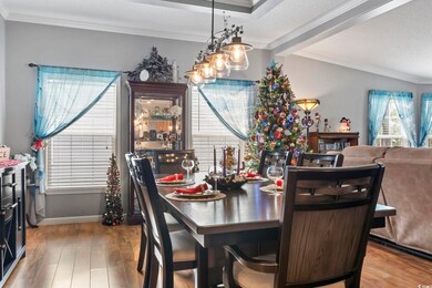 Dining room featuring ornamental molding, a textur