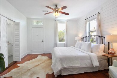 Primary bedroom features walk in closet and access