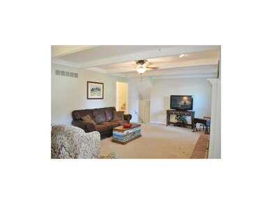 Living room with gas fireplace. Very light and bri