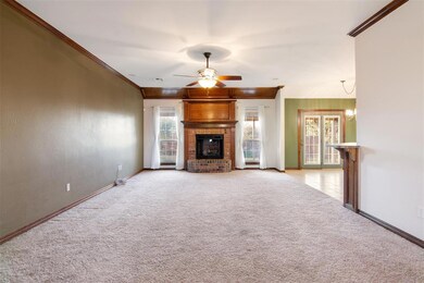 Unfurnished living room featuring ornamental moldi