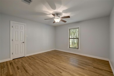 Unfurnished room with light wood-style floors, a 