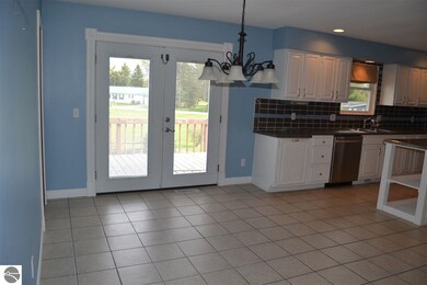 French doors leading to raised deck.