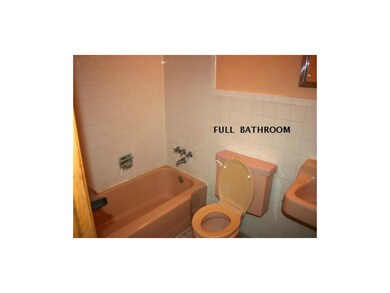 Hall bathroom, shower over tub.