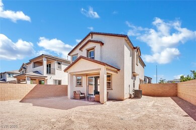 Rear view of house featuring a fenced backyard, stucco siding, a patio, and a tile roof