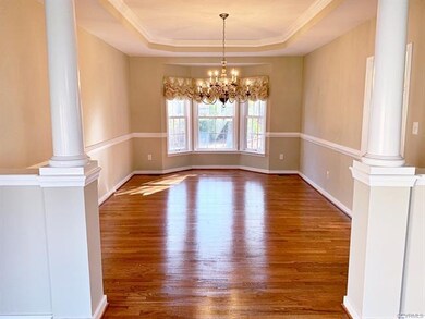 The Elegant Formal Dining Room is complimented by 