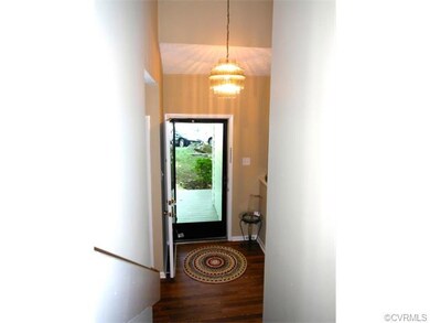 Another view of the stunning foyer. Laminate floor