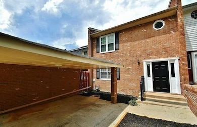 Property entrance with brick siding