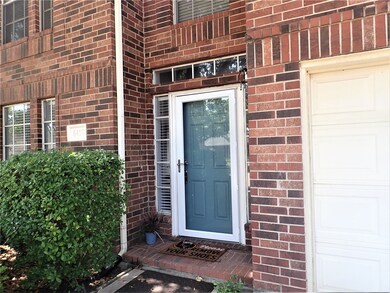 Storm doors and freshly painted front door.