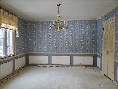 Formal dining room with doors to kitchen