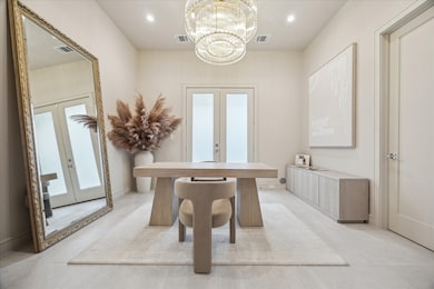 First floor offers a versatile bedroom with en-suite bath, thoughtfully appointed as a home office.  Shall we see where the French doors lead?