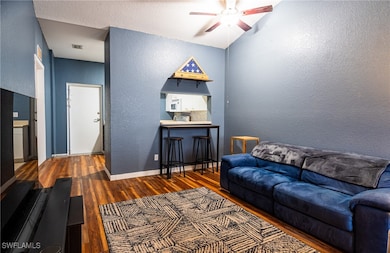 Living room featuring dark hardwood / wood-style f