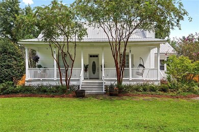 Classic Acadian with front and side porches