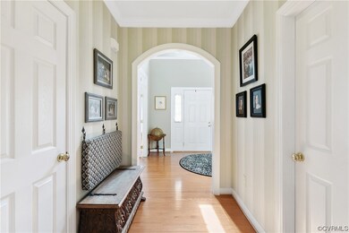 Hallway off Foyer to Powder Room and Main Living a