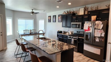 Kitchen with appliances with stainless steel finis