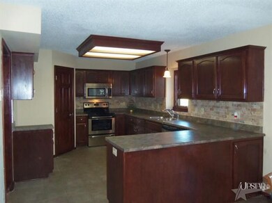The dishwasher and range are new.