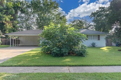 View of front of home featuring a front lawn and a