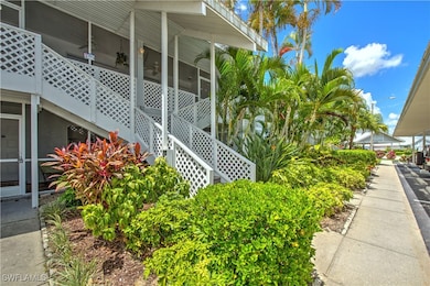 View of side of home featuring stairway and a sunr