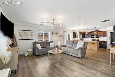 Living Room Opening Up To Kitchen