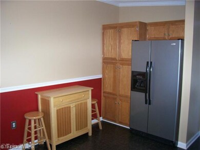 Kitchen. Large pantry located by the refrigerator.  HOME IS BEING SOLD FURNISHED.