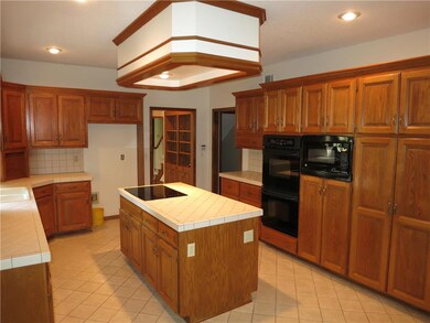 Additional view of kitchen. Flat top electric rang