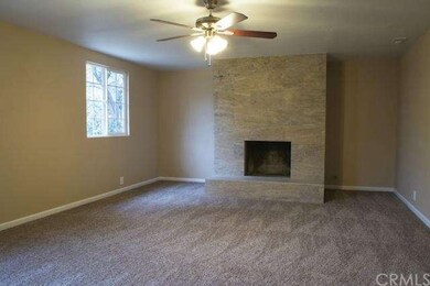 Exquisite Stone Faced Fireplace anchors the Master