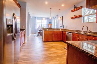 Kitchen with Granite Countertops Wood Cabinets