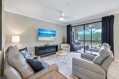 Living room featuring ceiling fan, visible vents, ornamental molding, and baseboards