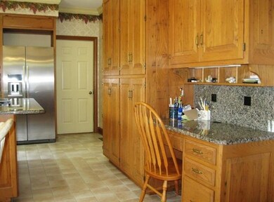 Wall of extra tall cabinets for storage in kitchen